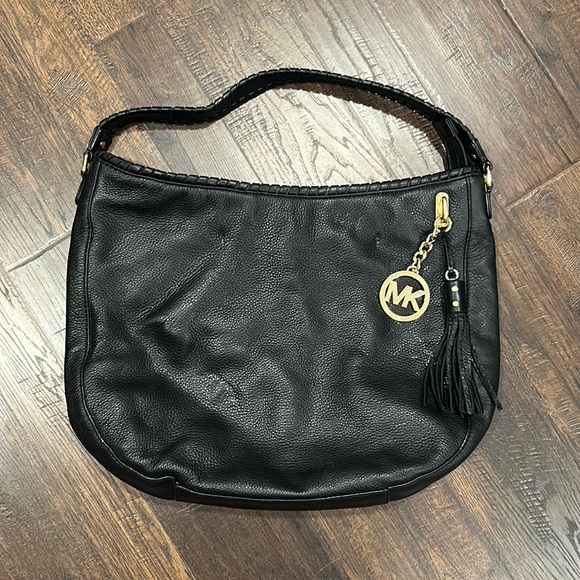 Michael Kors Handbags - Michael Kors black soft leather tassel bag